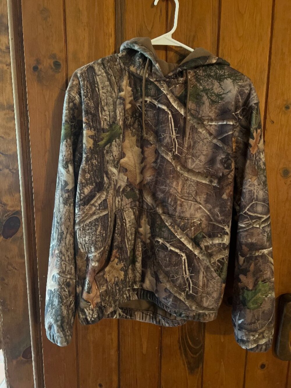 Durable camo hoodie for outdoor wear features kangaroo pocket & drawstring